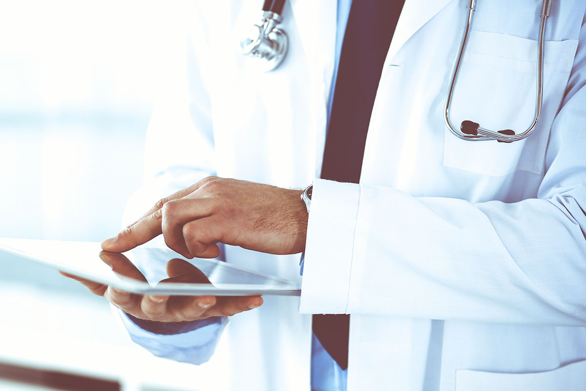 Surgeon looking at an ipad