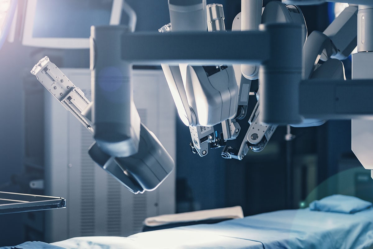 High tech surgical robot in empty patient room