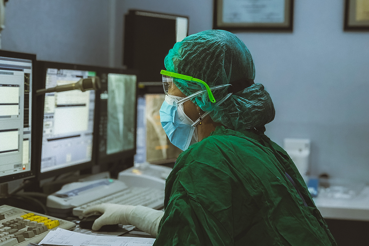 Surgeon at a computer